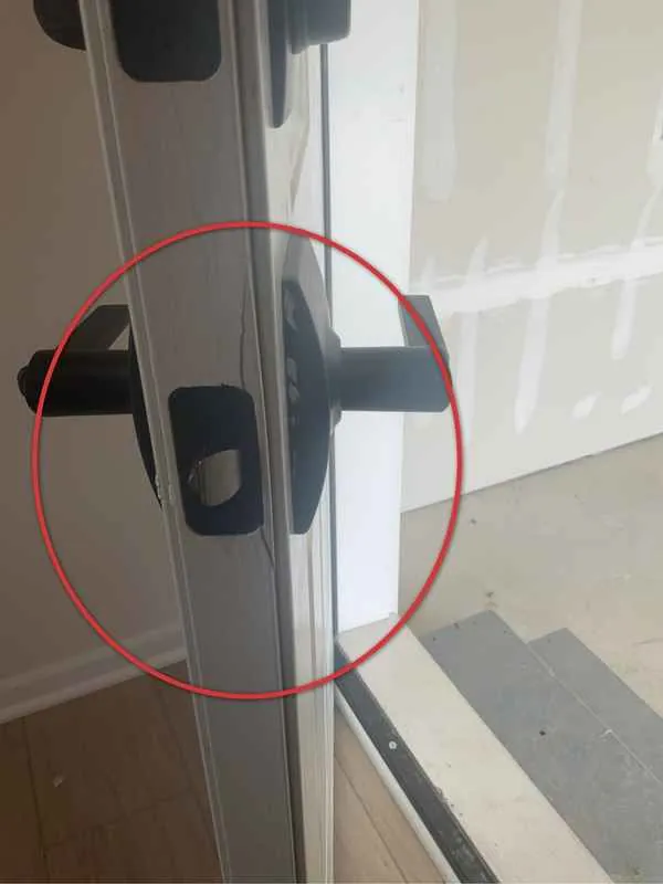 Garage to house door slab cracked at the lock hardware in a new construction home
