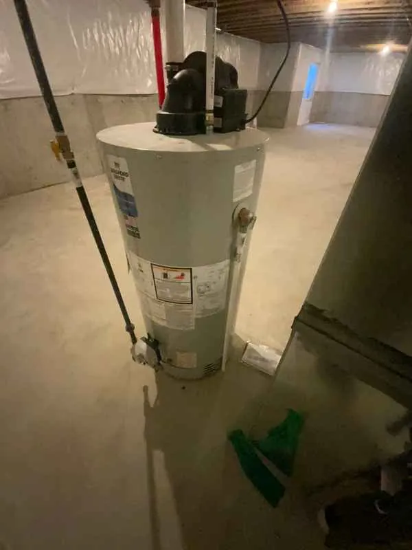 Gas water heater in the unfinished basement of a new construction home