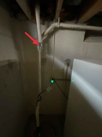 Discharge tied into sanitary stack