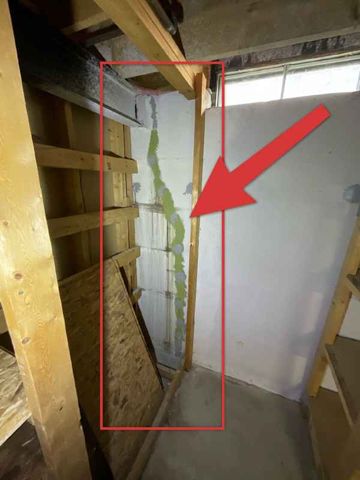 Previously repaired crack with active staining